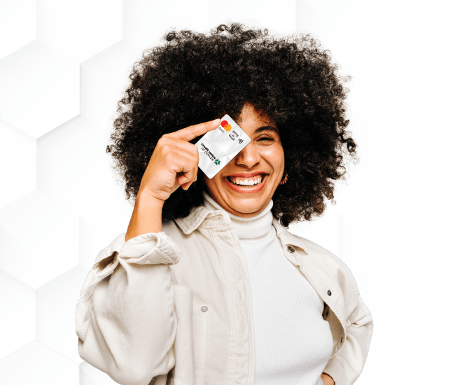 Woman smiling and holding a CUD debit card in front of her face