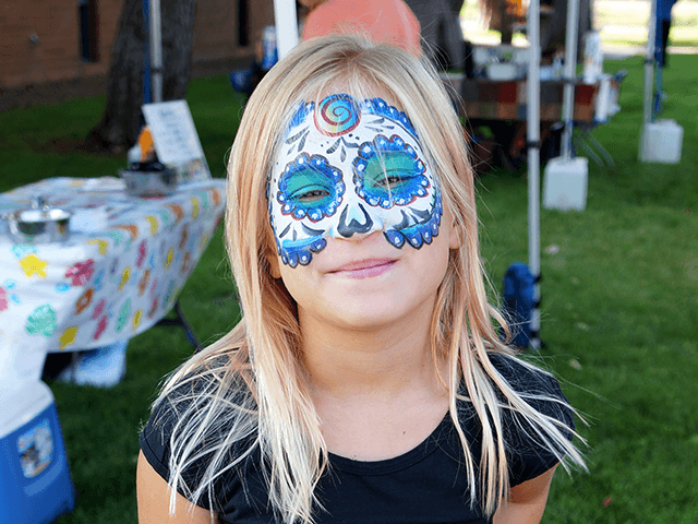 Close-up of a girl's painted face.