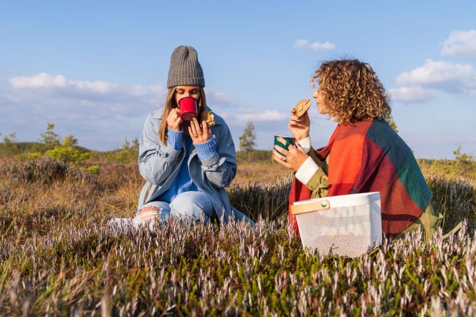 Two women enjoy a picnic