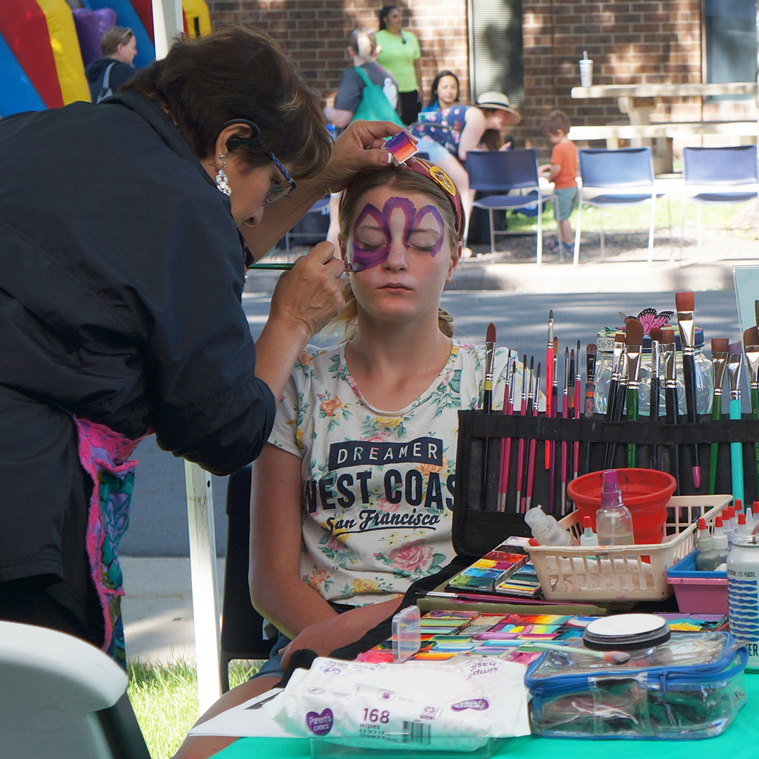 Girl getting her face painted