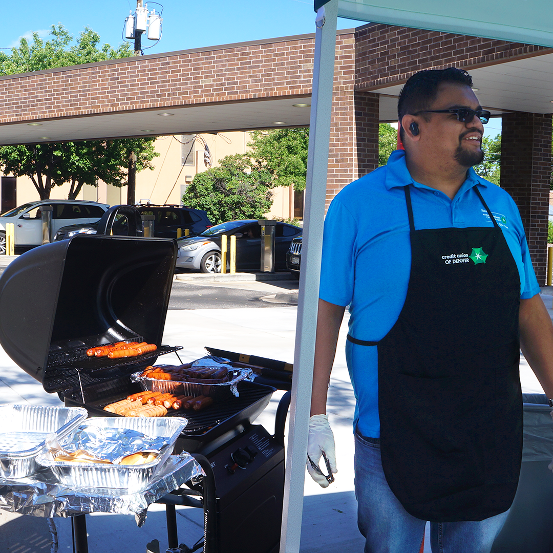 CUD employee cooking hotdogs