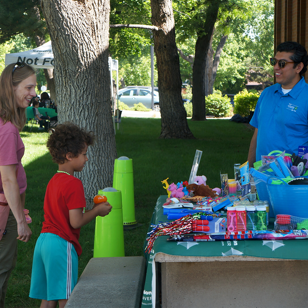 CUD employee giving a kid a fun prize