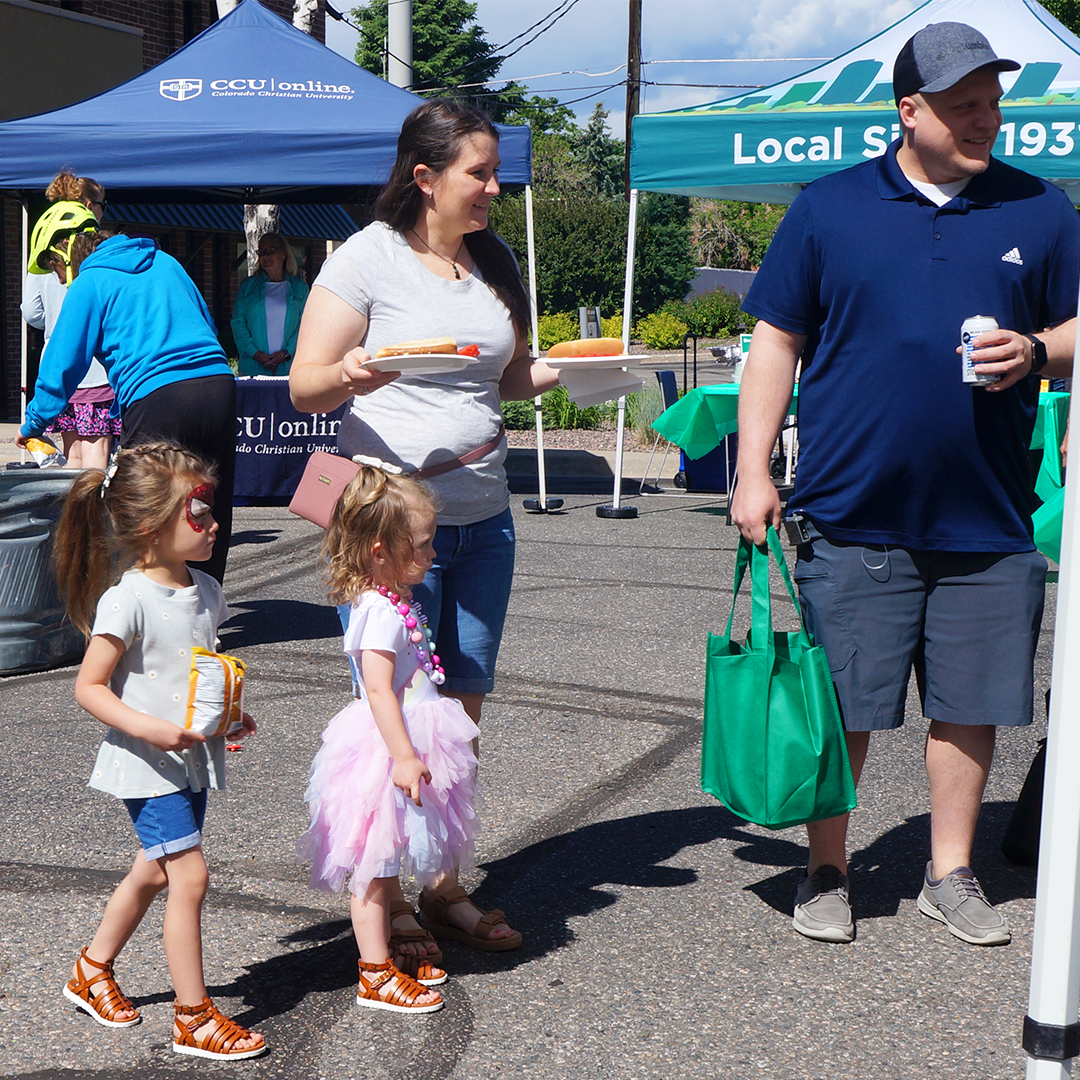 Family enjoying the food and vendors at the event