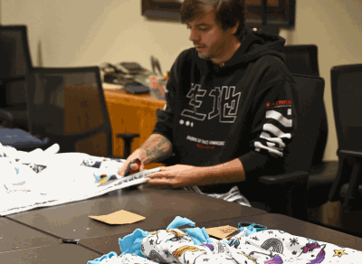 Volunteer working on no sew blanket
