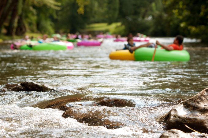 People Tubing Down River