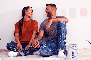 Couple sitting down after painting