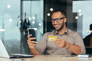 Happy man with credit card