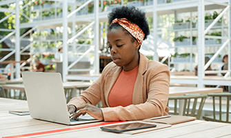 African American woman working on her laptop