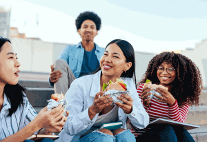 Students eating outside together