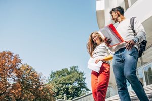 Two college students walking together