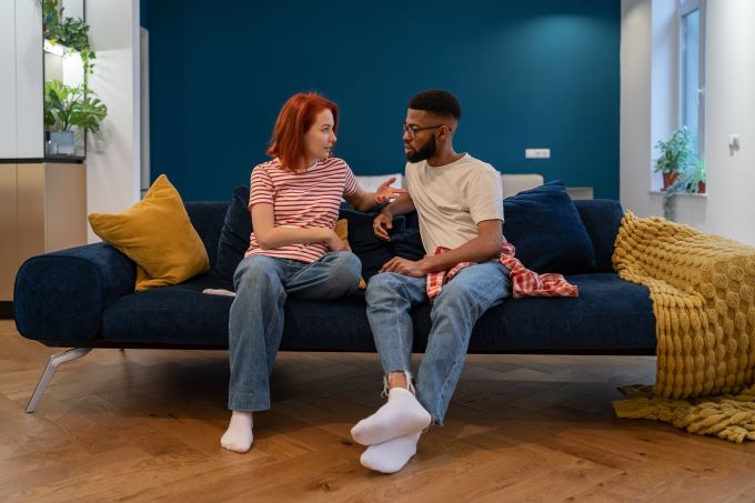 Couple talking on the couch