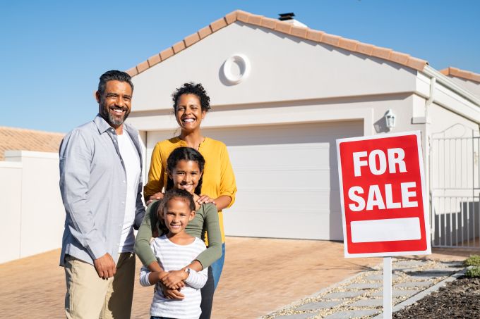 family outside house for sale