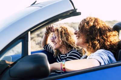 Friends driving in car