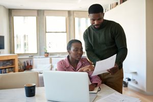 couple looking through bills