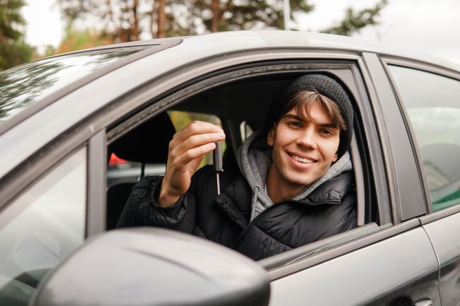 Man in car holding keys