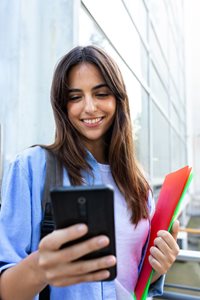 Female student looking at cellphone